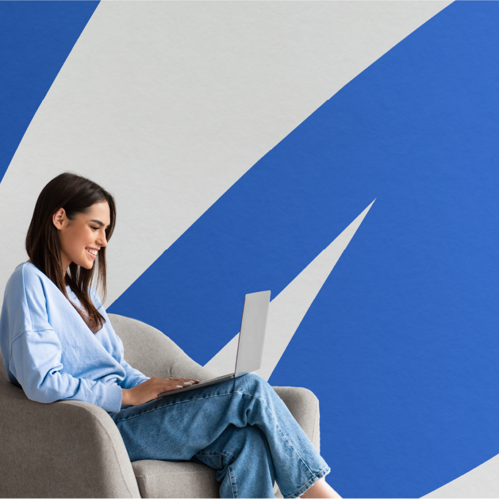 Woman working on a laptop with a big blue Empower swoosh behind her.